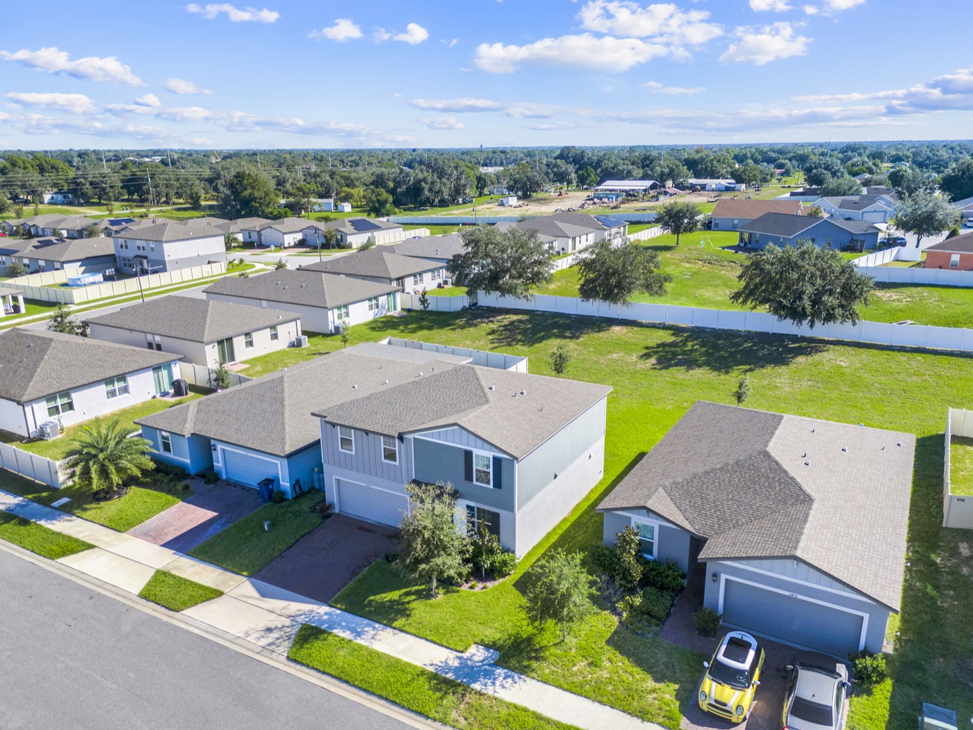 Aerial view of the home and street
