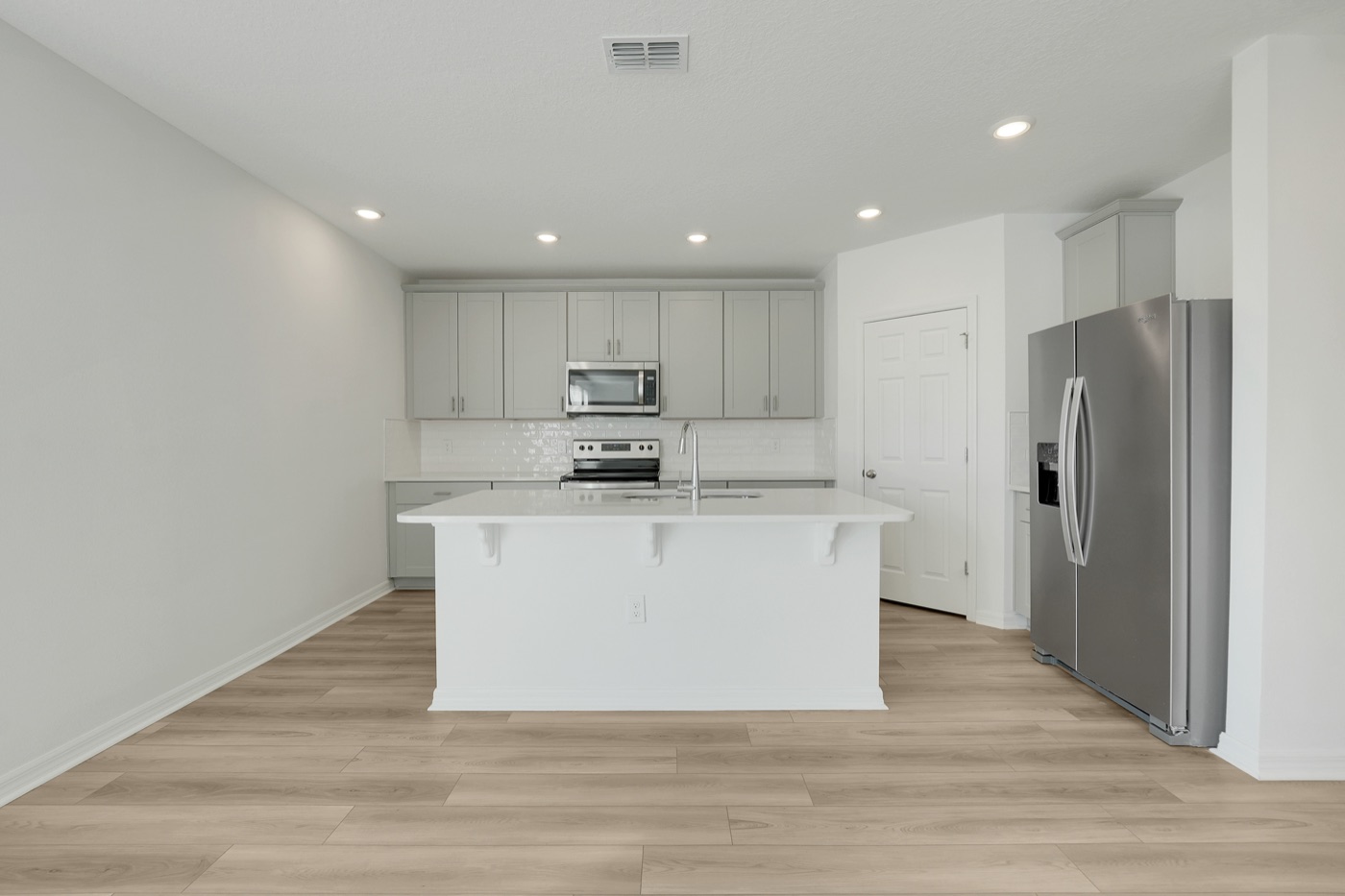 Kitchen with a large island and stainless steel appliances